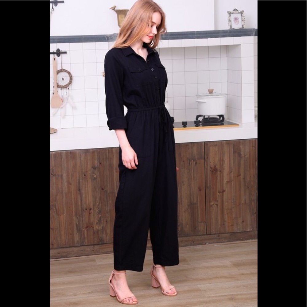 Black cotton utility button down jumpsuit.